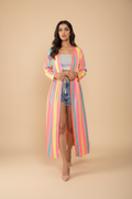 Woman wearing a colorful striped kimono-style garment on a white background