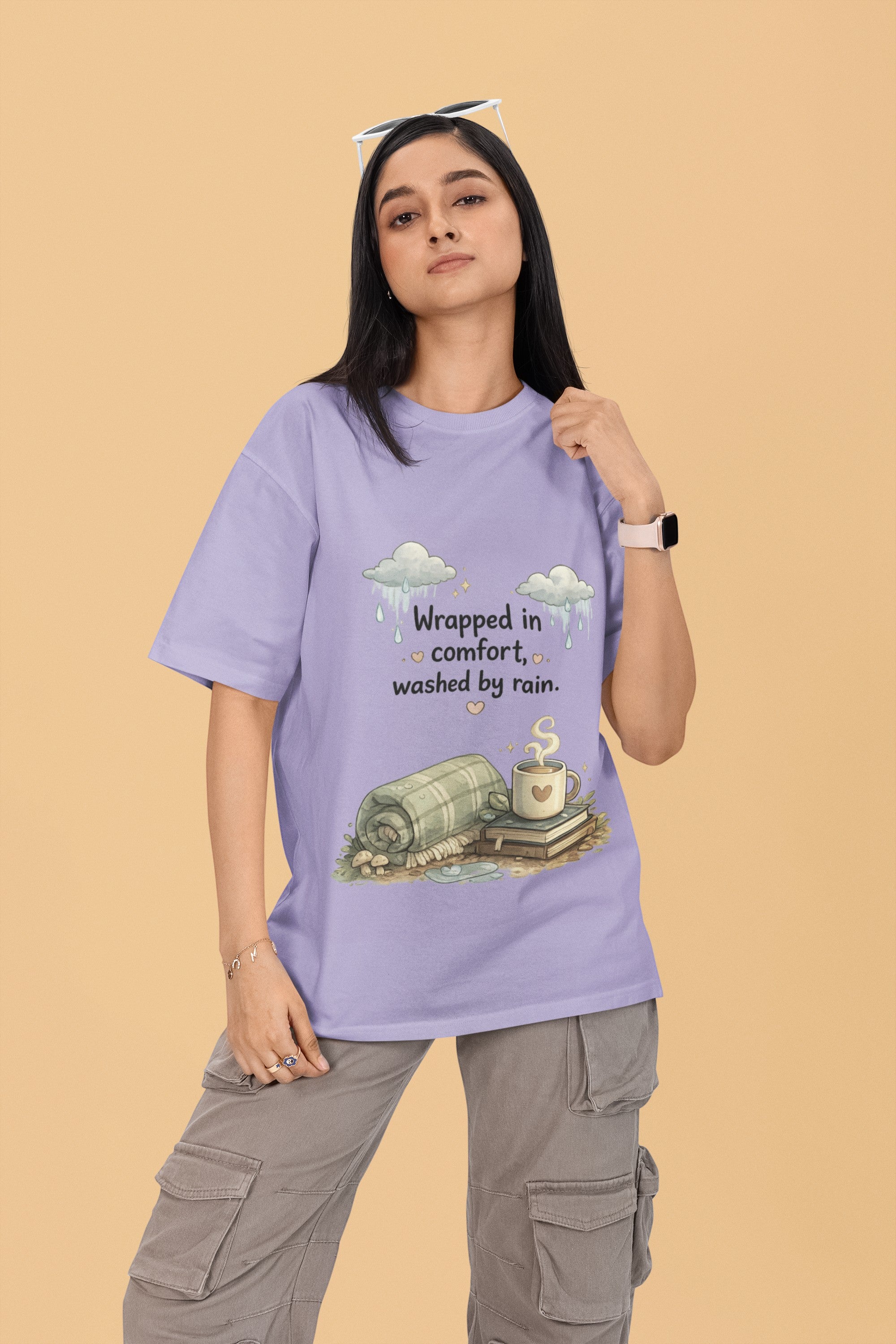 Model wearing a Snuggle Spot lavender oversized terry-knit t-shirt with a cozy rain-themed graphic print.