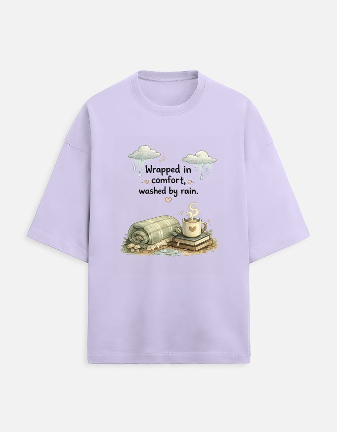Snuggle Spot lavender oversized terry-knit t-shirt with Wrapped in Comfort graphic featuring a cozy blanket and mug.