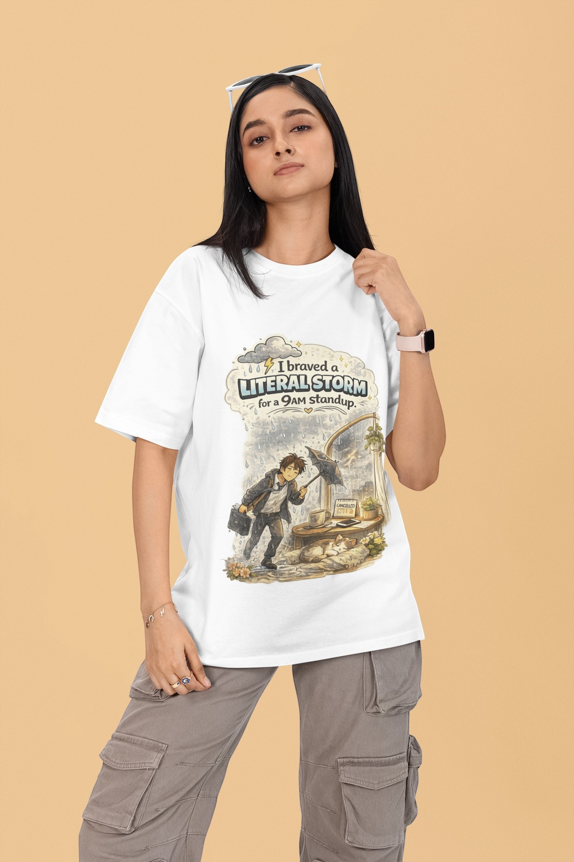 Woman wearing a Snuggle Spot white oversized terry-knit t-shirt with a graphic print about a rainy morning meeting.