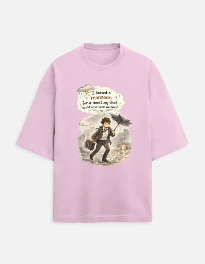 Snuggle Spot light pink oversized unisex t-shirt featuring a graphic of a man in a monsoon with a humorous quote.
