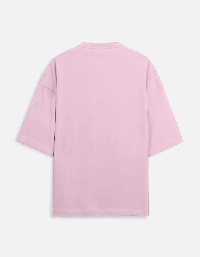Back view of a Snuggle Spot unisex oversized t-shirt in light pink, made from premium 260 GSM terry-knit fabric.